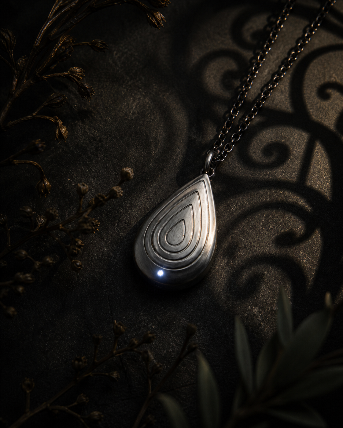 Silver Drop or Pearl talisman styled in a moody editorial setting